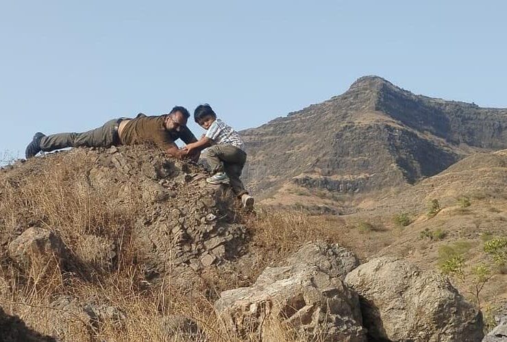Beginner rock climber ascending a cliff with an illustrated guide showing essential climbing gear, safety practices, and basic climbing techniques against a mountain backdrop.