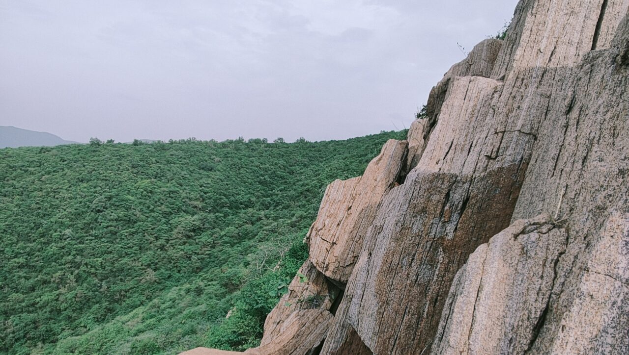 Trek Like a Commander guide featuring a lone trekker overlooking a dramatic mountain landscape, highlighting precautions, pace, protocol, preparation, communication, and adaptability.