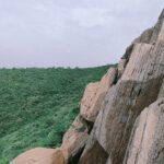 Trek Like a Commander guide featuring a lone trekker overlooking a dramatic mountain landscape, highlighting precautions, pace, protocol, preparation, communication, and adaptability.