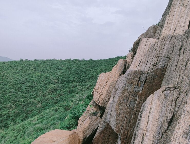 Trek Like a Commander guide featuring a lone trekker overlooking a dramatic mountain landscape, highlighting precautions, pace, protocol, preparation, communication, and adaptability.